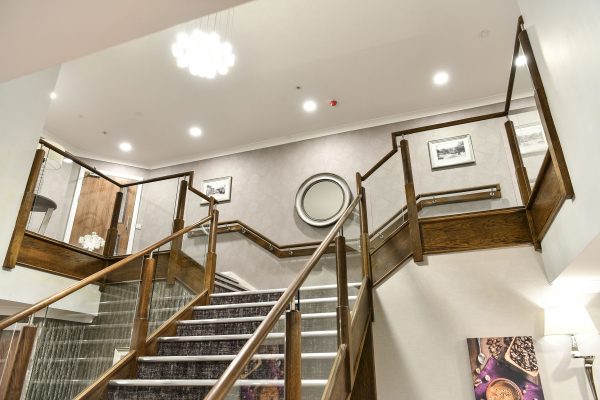An interior view of the main stairs at Hen Cloud House
