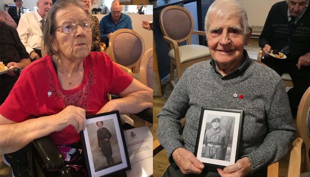 Edith and Vincent with photos of themselves in the armed forces.